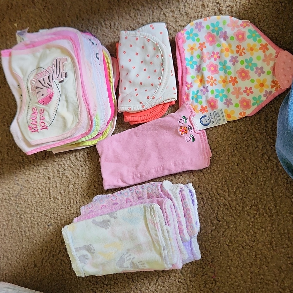 Bundle of girl's bibs and burp cloths
